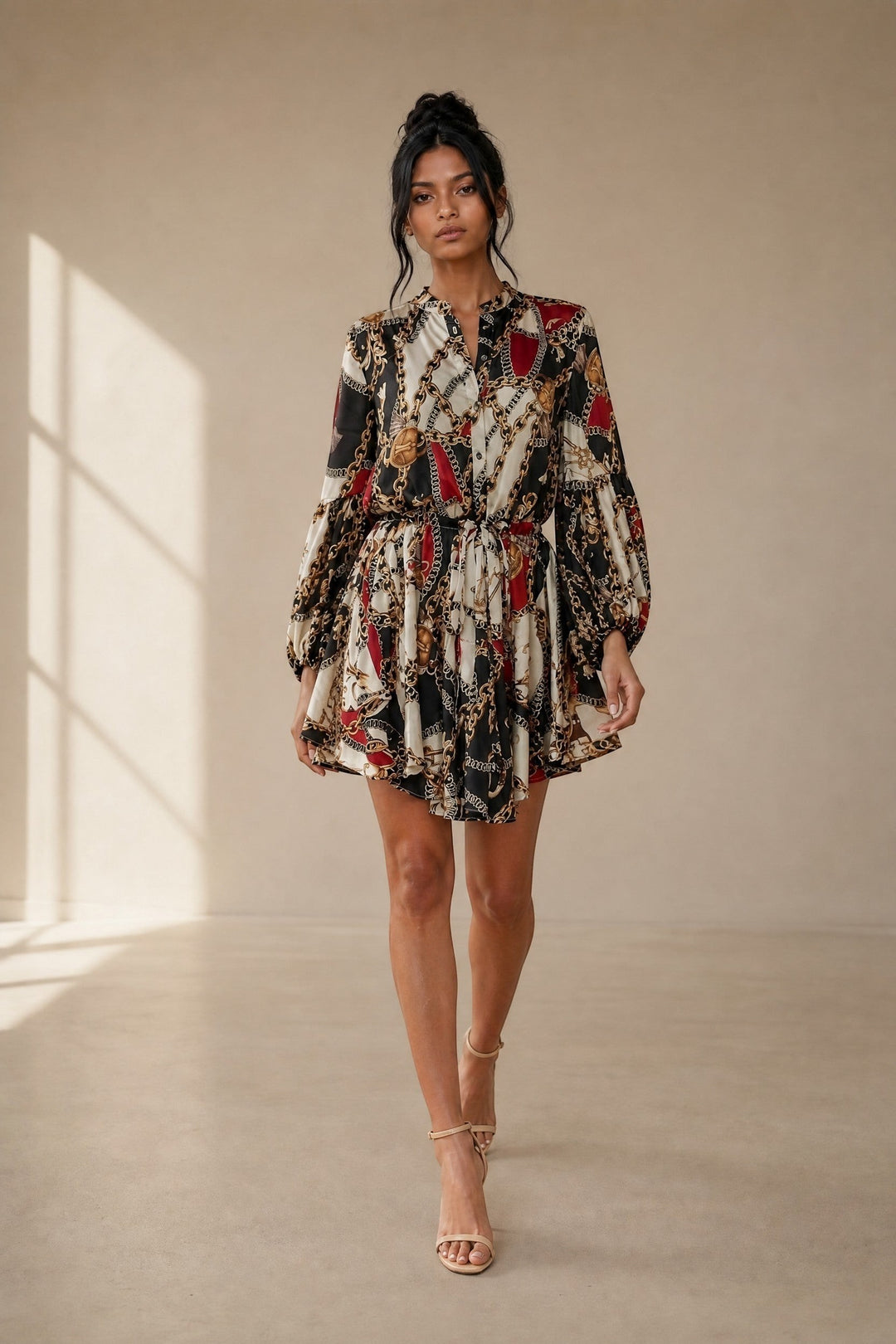 CAL JUNE Aria mini dress with chain and baroque print, V-neck, button-front, drawstring waist, balloon sleeves, and flared skirt.