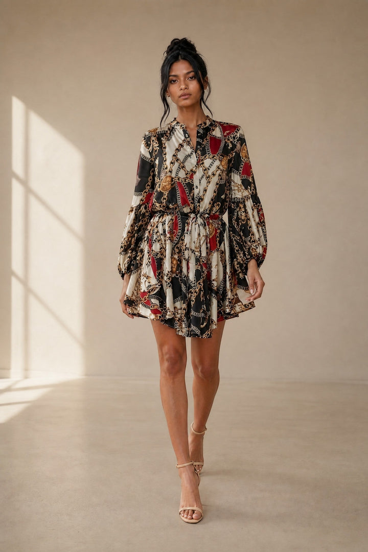 CAL JUNE Aria mini dress with chain and baroque print, V-neck, button-front, drawstring waist, balloon sleeves, and flared skirt.