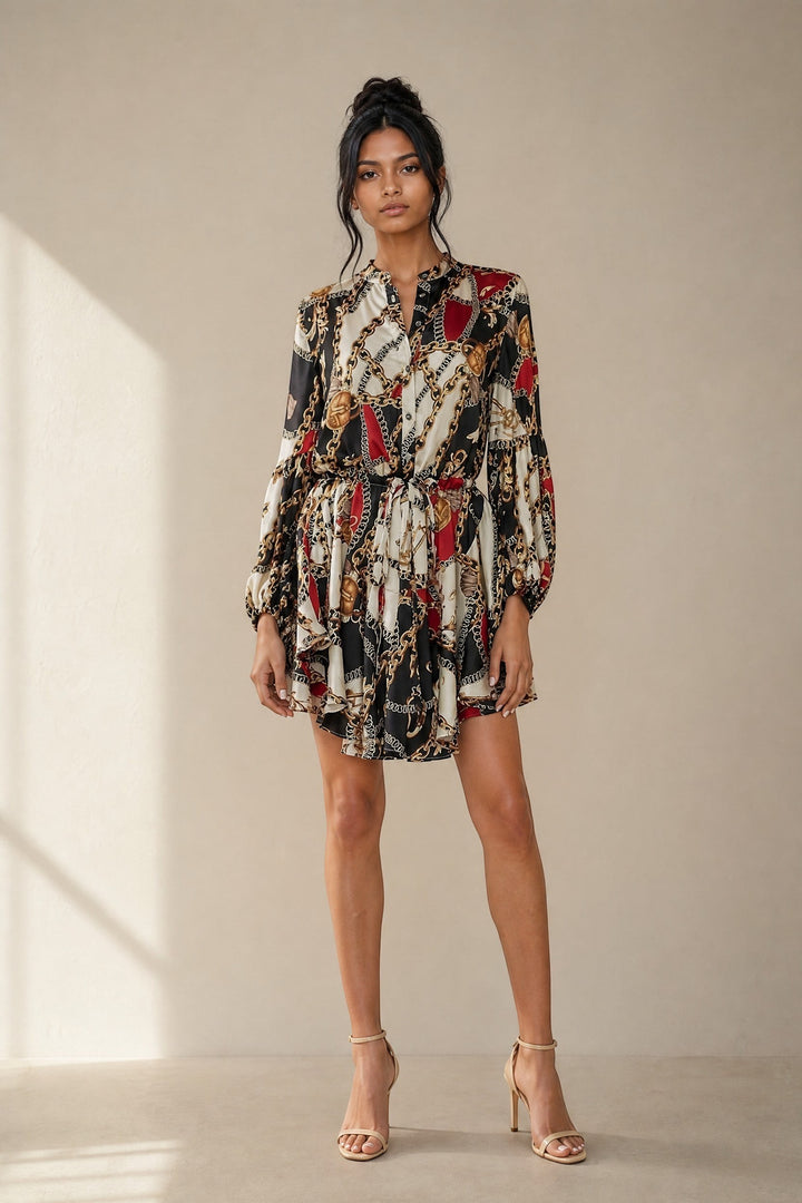 CAL JUNE Aria mini dress with chain and baroque print, V-neck, button-front, drawstring waist, and balloon sleeves.