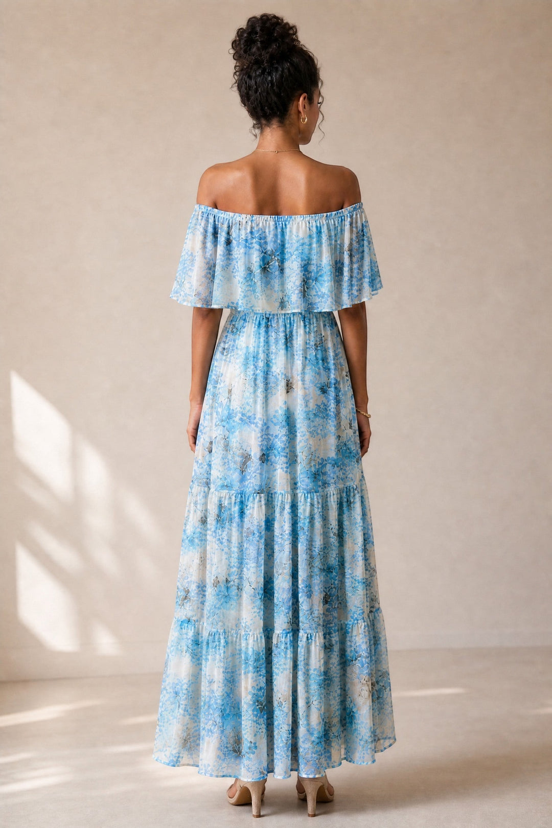 CAL JUNE Arielle off-shoulder floral maxi dress with tiered skirt in blue and white. Flutter sleeves and drawstring waist.