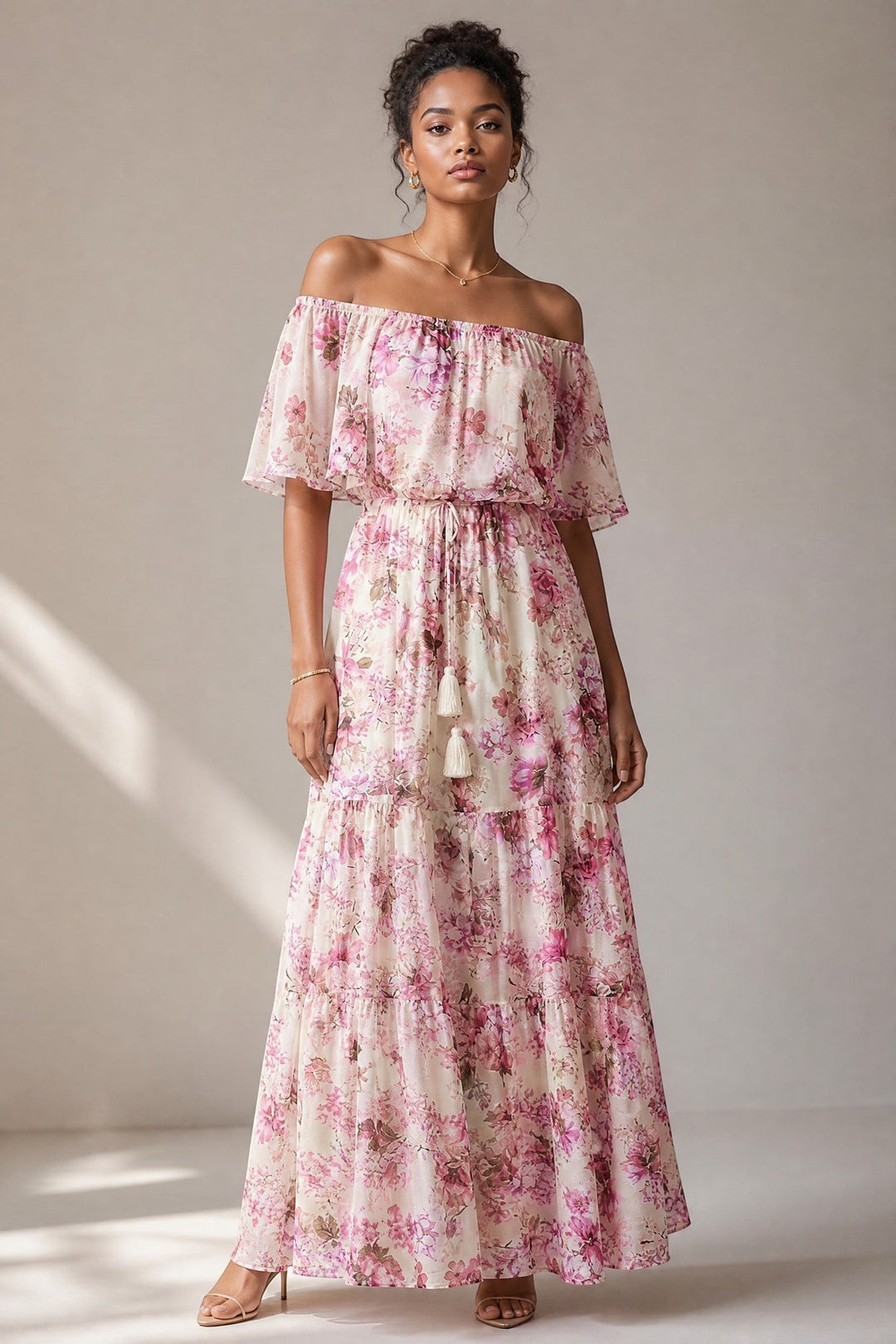 CAL JUNE Arielle off-shoulder maxi dress with pink and purple floral print, flutter sleeves, and tassel drawstring waist.