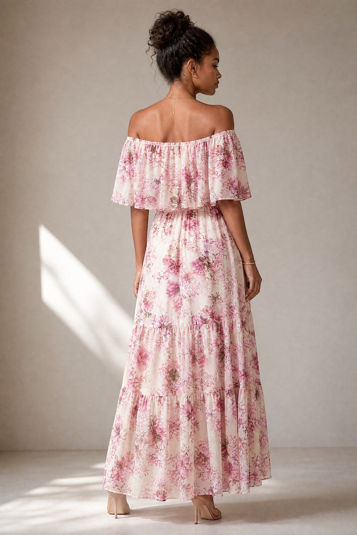 CAL JUNE Arielle off-shoulder floral maxi dress in pink and purple on cream with flutter sleeves and tiered skirt.