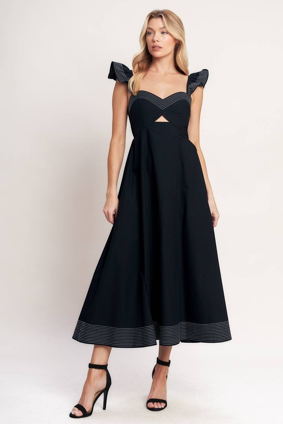 CAL JUNE black midi dress with sweetheart neckline, cutout detail, and contrast stitching on straps and hem.