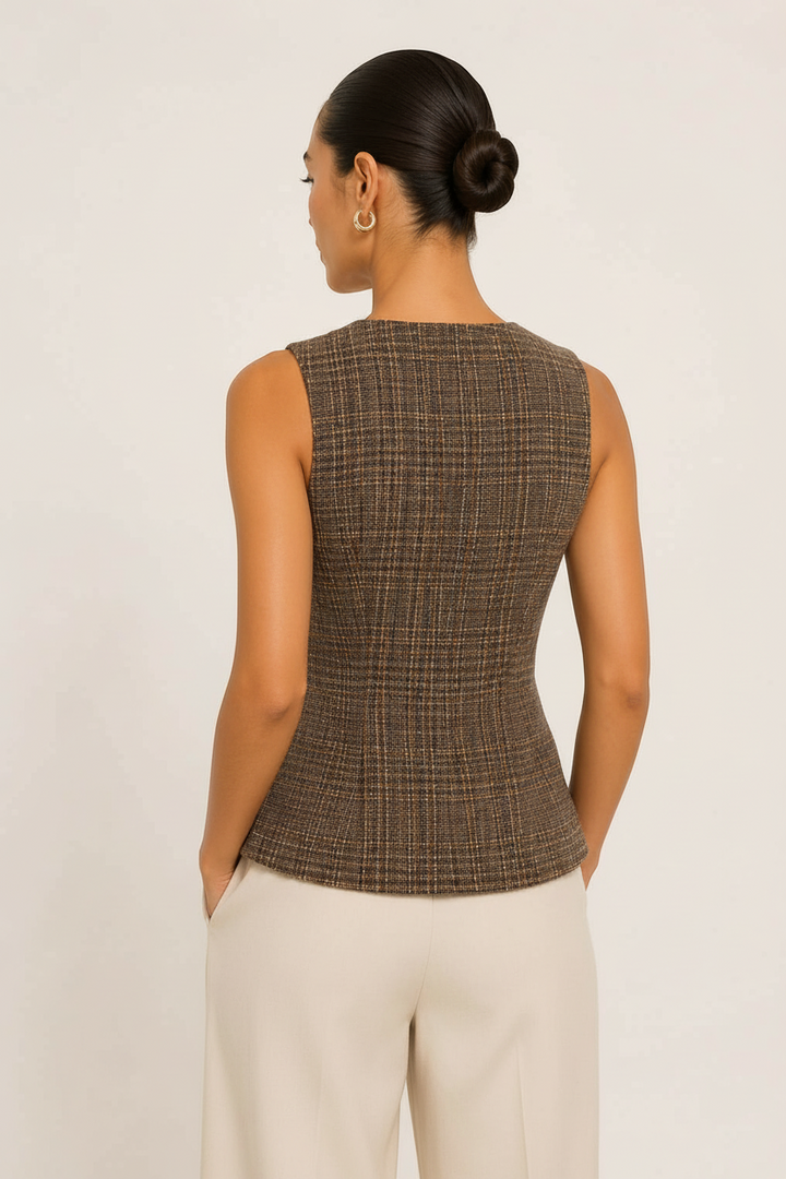 Back view of a model wearing a CAL JUNE brown tweed tailored vest with a fitted silhouette and sleeveless design.