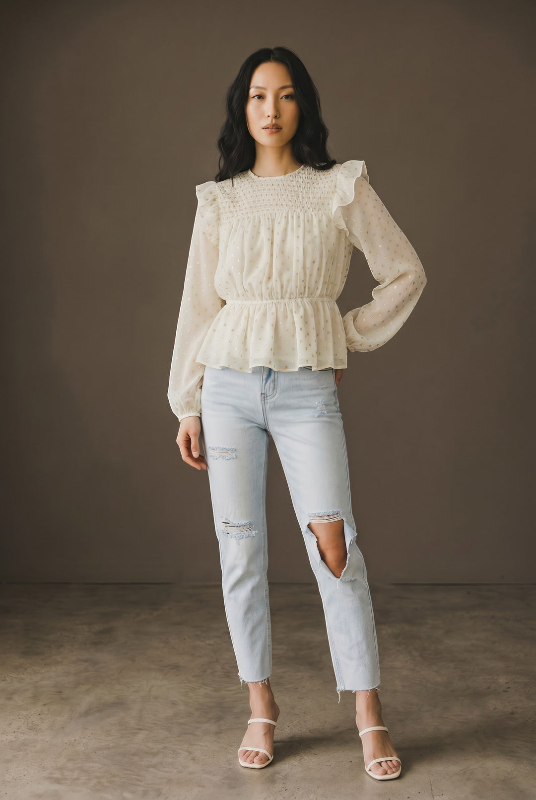 CAL JUNE cream sheer peplum blouse with scattered gold dots, ruffled neckline, and long sleeves.