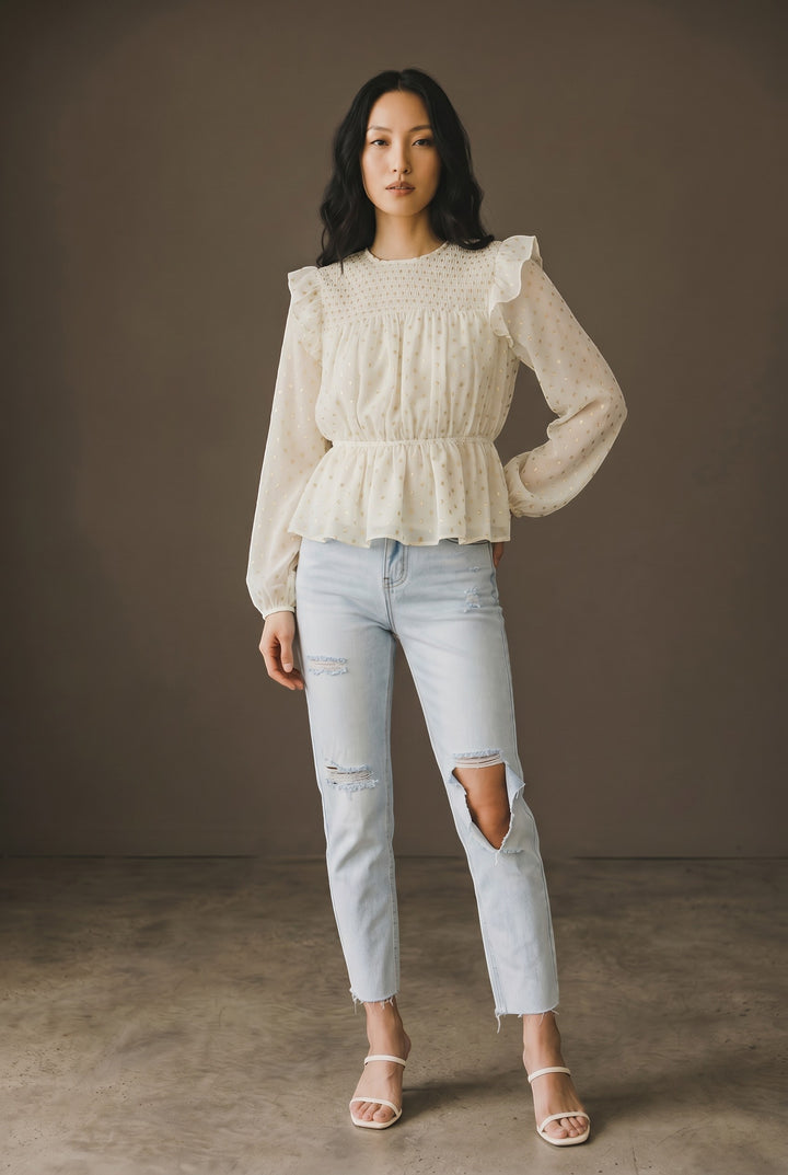 CAL JUNE cream sheer peplum blouse with scattered gold dots, ruffles, and billowy sleeves.