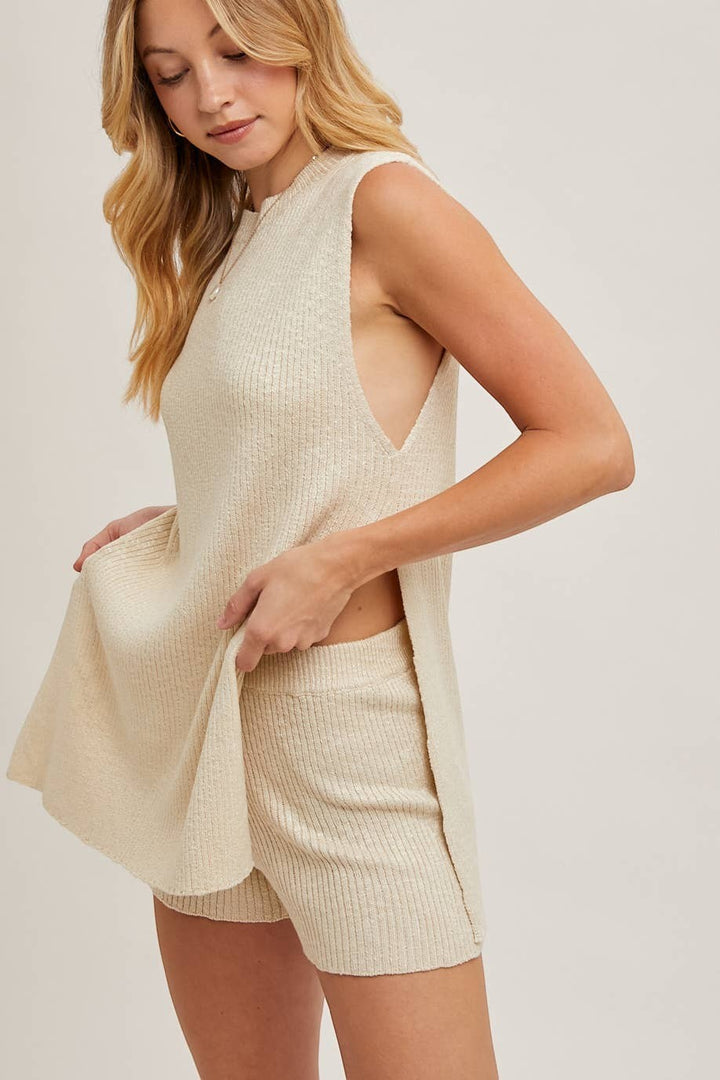 CAL JUNE cream ribbed knit sleeveless top and matching shorts lounge set on a model.