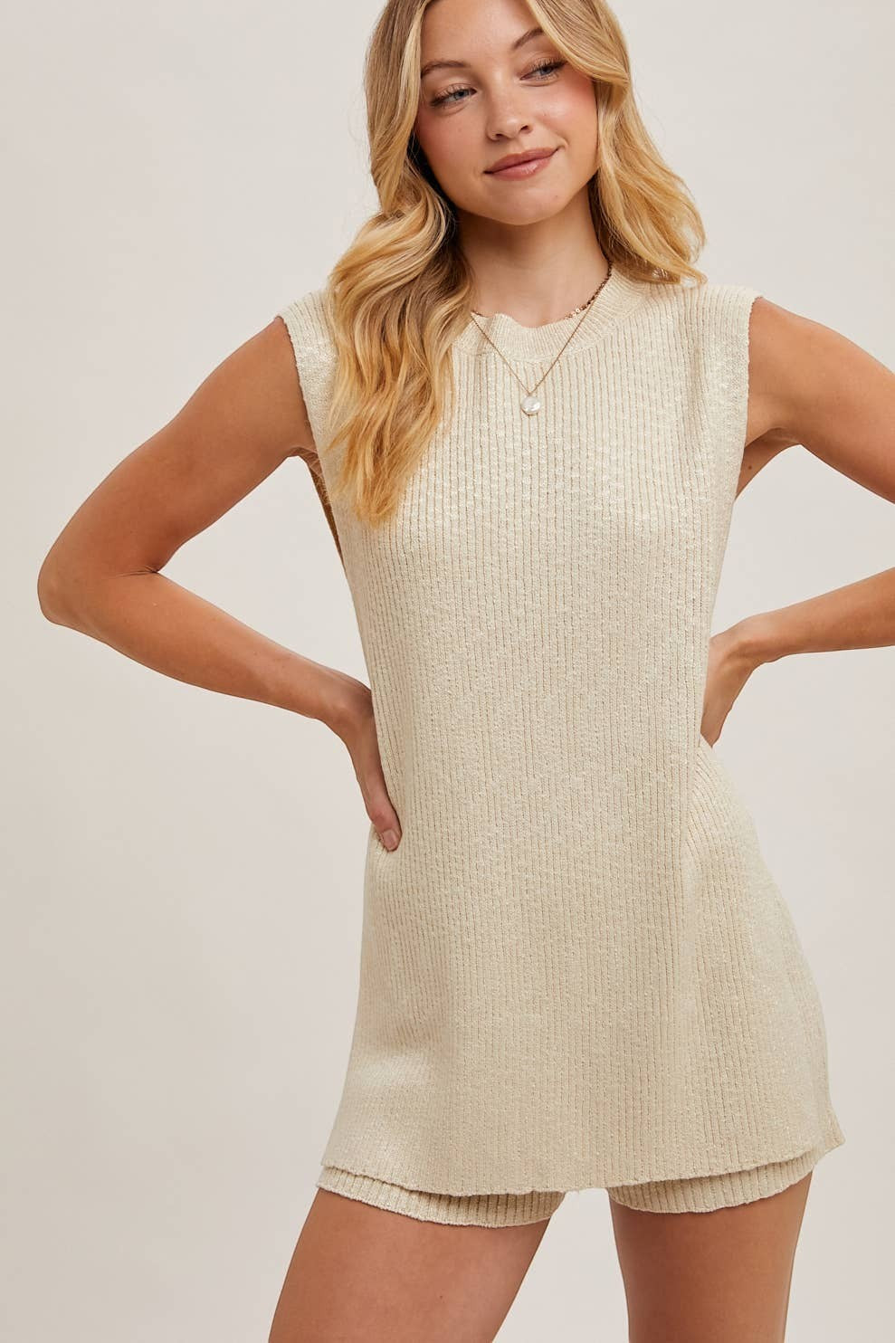 CAL JUNE cream ribbed knit sleeveless top and shorts lounge set on a model.
