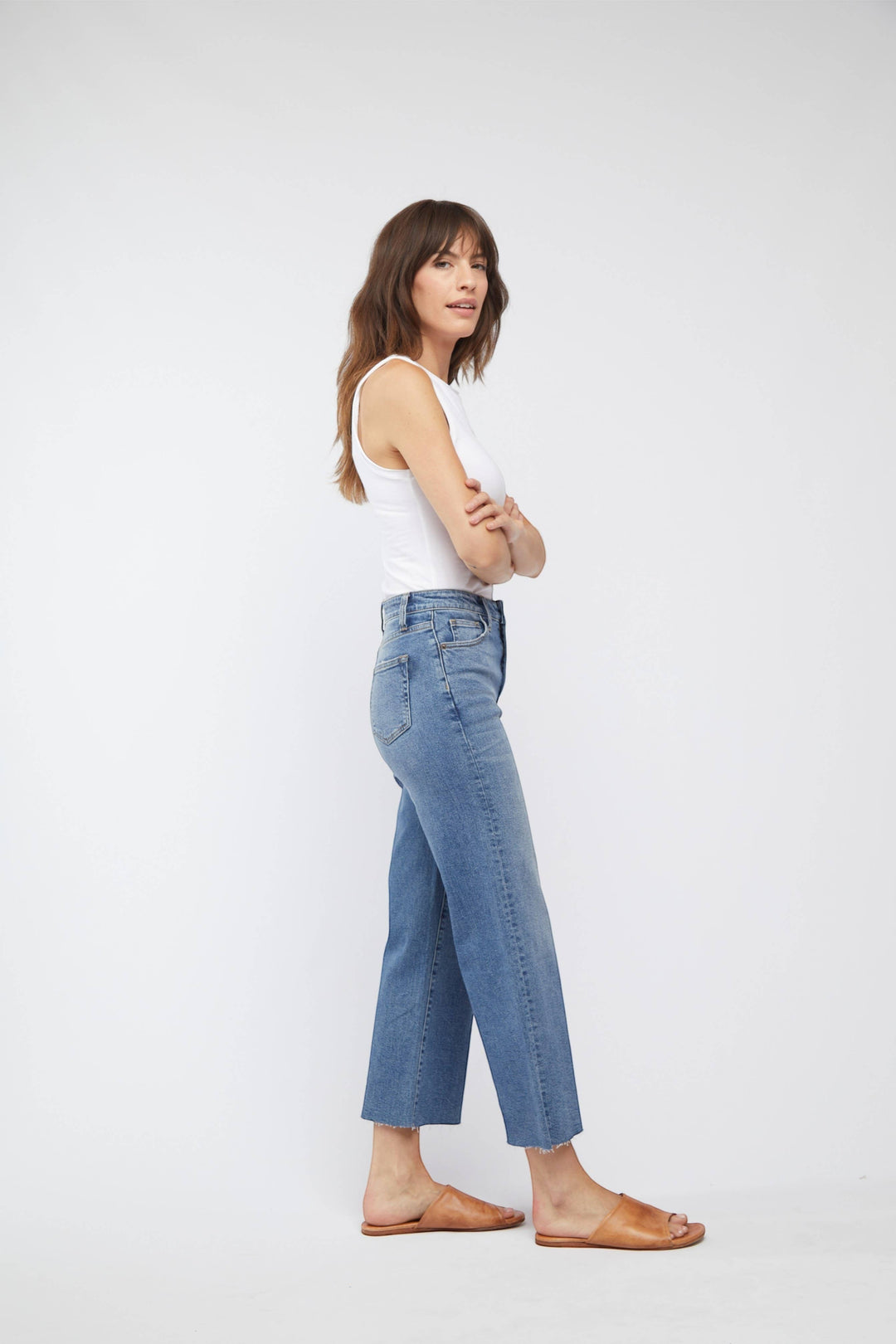 CAL JUNE The Daisy Cropped High-Rise Jean in vintage worn wash. High-rise, wide-leg jeans with a raw hem. Made from recycled cotton with 1% stretch.