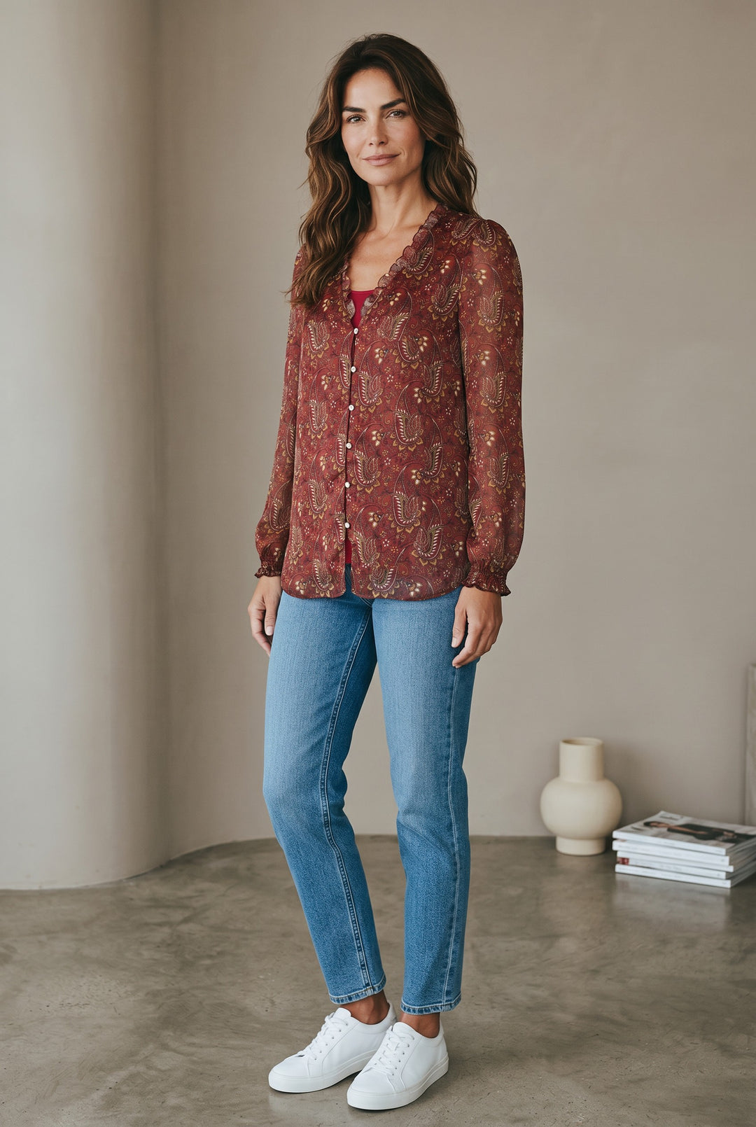 CAL JUNE The Elizabeth Ruffle Blouse in red paisley print with ruffled neckline and cuffs. Button-up front.