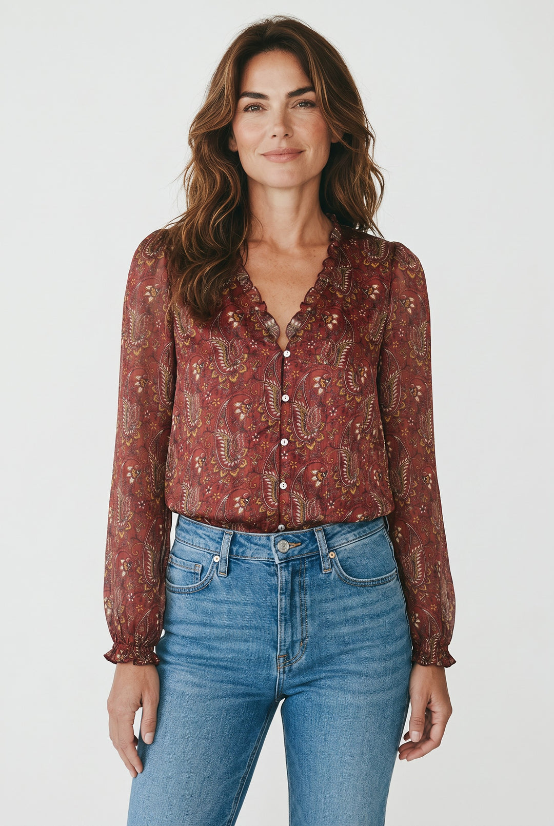 CAL JUNE The Elizabeth Ruffle Blouse in red paisley print with ruffled neckline and cuffs. Button-up front.