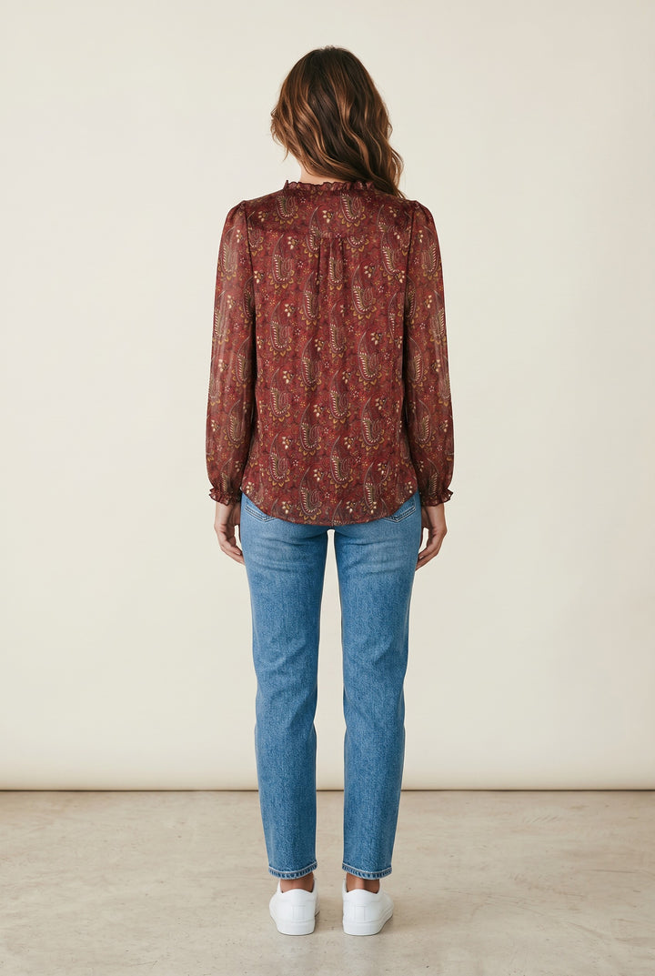 CAL JUNE The Elizabeth Ruffle Blouse, red paisley print sheer long sleeve blouse with ruffled neckline and cuffs.