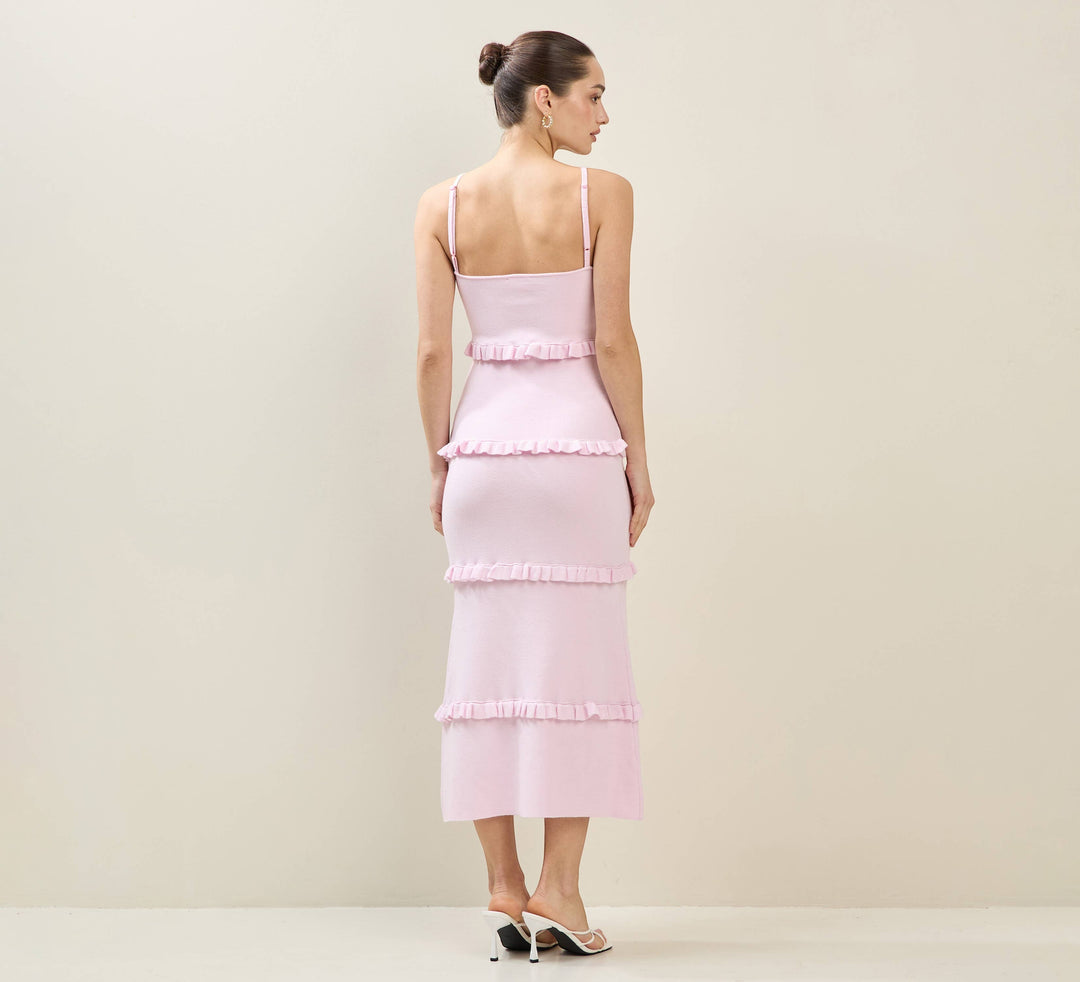 CAL JUNE Elodie tiered maxi dress in light pink knit with ruffle detailing and spaghetti straps.