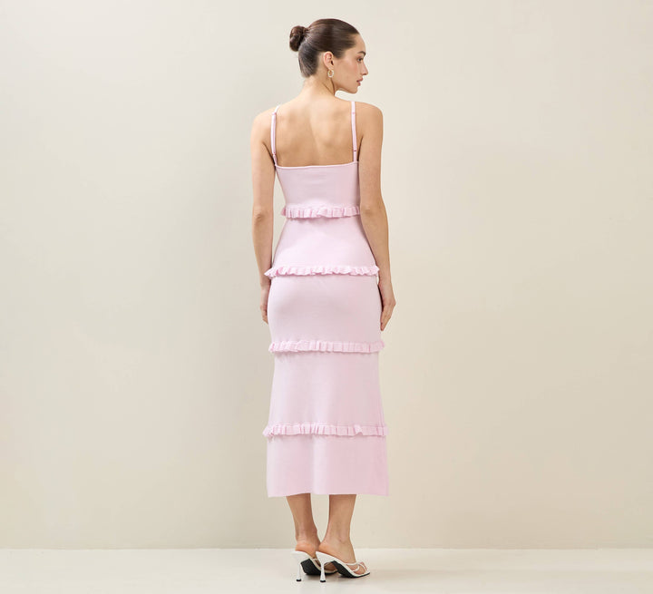 CAL JUNE Elodie tiered maxi dress in light pink knit with ruffle detailing and spaghetti straps.