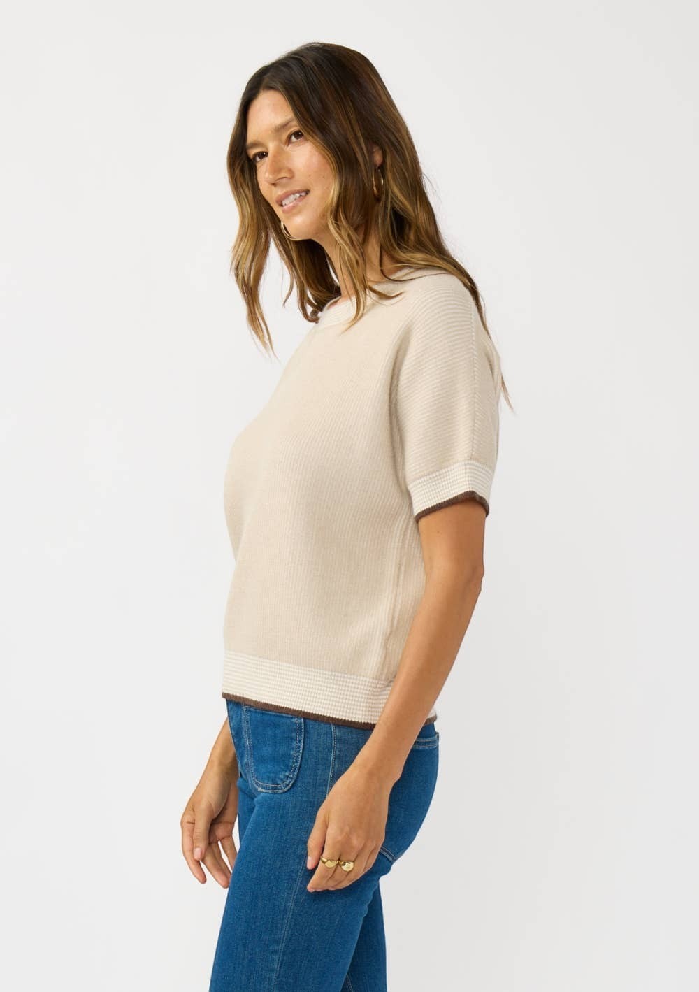 CAL JUNE The Jade Contrast Trim Top in cream with short sleeves and contrast trim detail. Model wears size S.