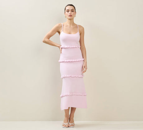 CAL JUNE light pink tiered knit maxi dress with spaghetti straps and ruffled detailing. Model is wearing size Small.