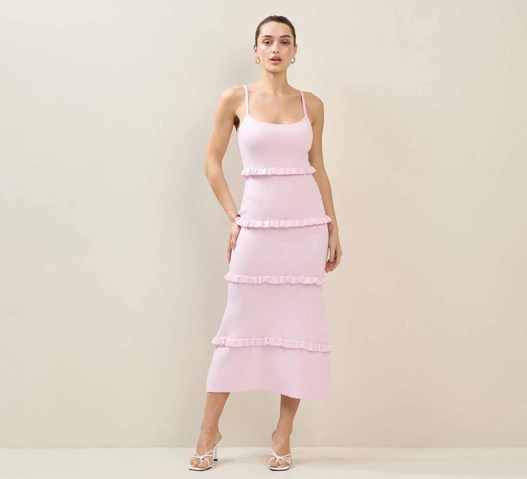 CAL JUNE pink tiered maxi dress with spaghetti straps and ruffled detailing. Model is wearing size Small.