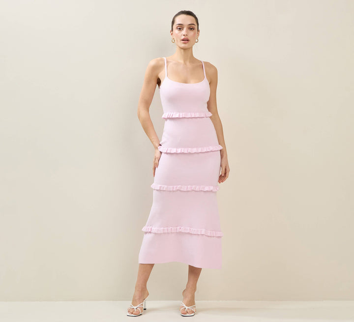 CAL JUNE pink tiered maxi dress with spaghetti straps and ruffled detailing. Model is wearing size Small.
