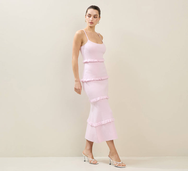 CAL JUNE light pink tiered maxi dress with spaghetti straps and ruffled detailing. Model wears size S.