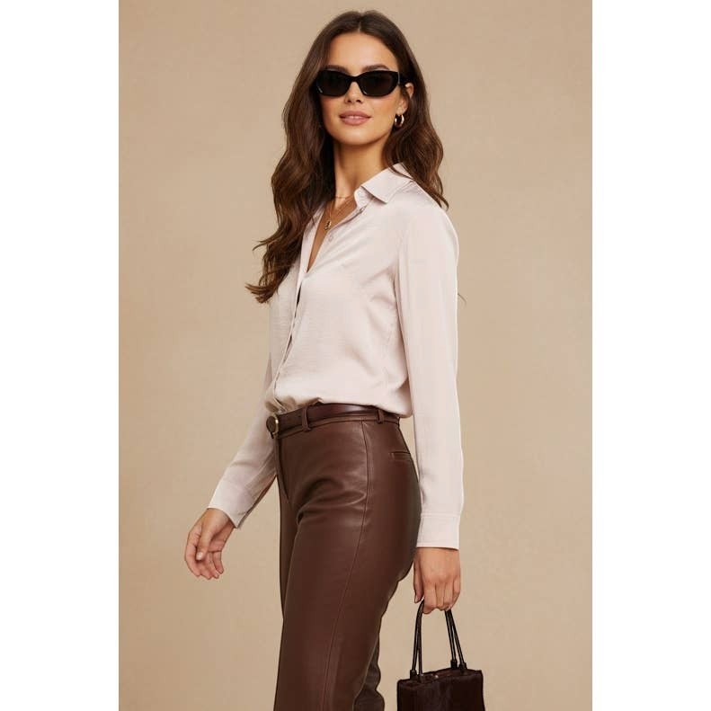 CAL JUNE Sienne button-front blouse in a light beige satin material. Model wears size Small.