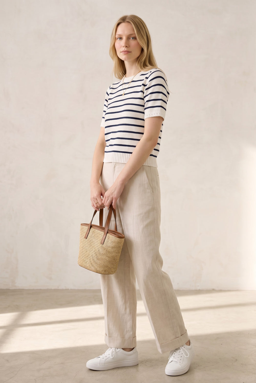 CAL JUNE white short-sleeve knit top with navy stripes and subtle eyelet detail on sleeves. 100% cotton.