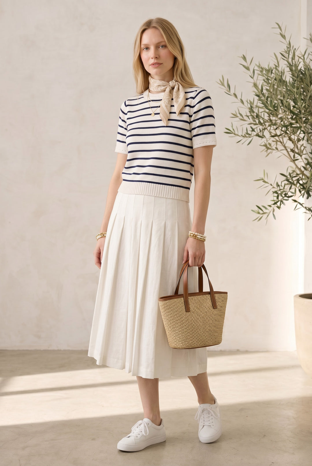 CAL JUNE white short-sleeve knit top with navy stripes, crew neck, and textured cuffs. Model wears size S.