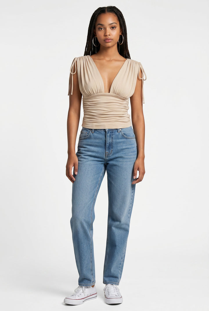 CAL JUNE The Sunnie Top in beige, a ruched V-neck sleeveless top with tie shoulder details.
