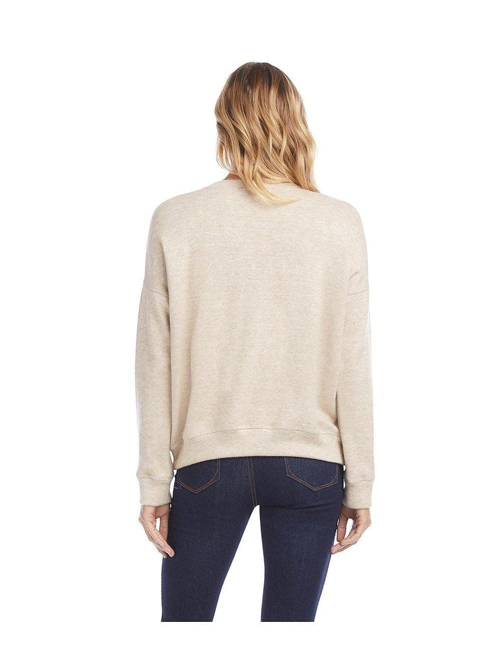CAL JUNE The Tessie Sweater Knit Top in beige, worn by a model.