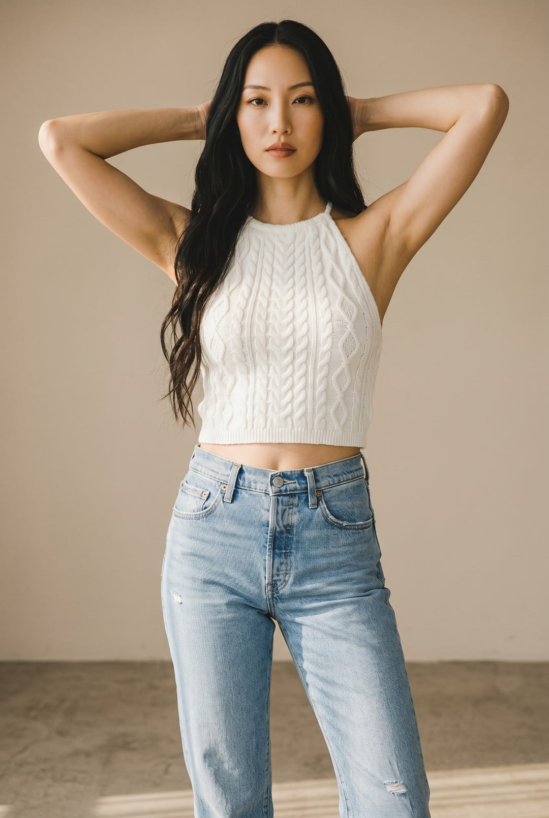 CAL JUNE white cable knit halter crop top with braided detailing. Model wears size Small.
