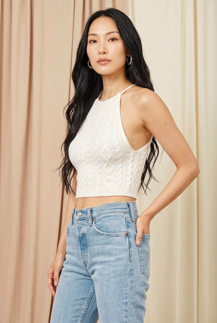 CAL JUNE white cable knit halter crop top with a structured bust and subtle texture. Model wears size Small.