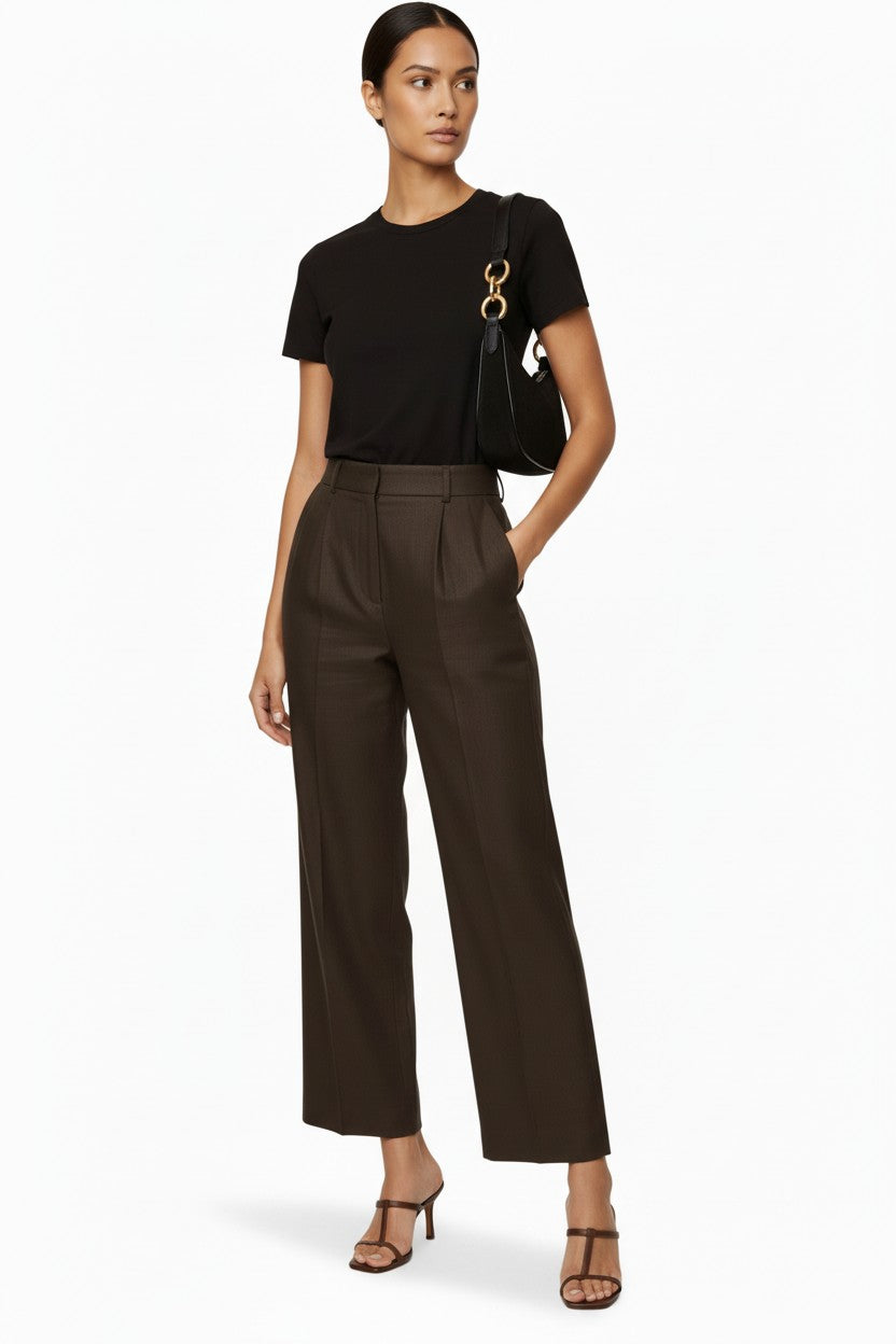 Model wearing CAL JUNE heather-choco tailored wide-leg flared pants with front darts and welt pockets.